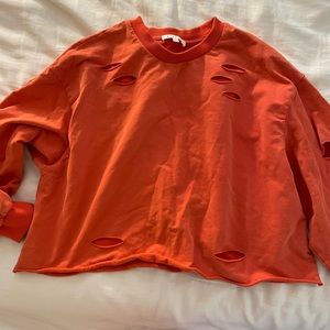 crew neck cropped red sweater with cut outs